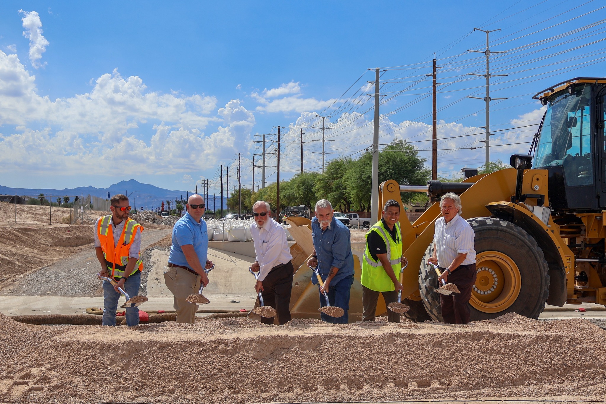 Clark County Public Works and Commissioner Tick Segerblom celebrate the start of the $13.9M Sloan Lane Improvements, extending Sloan Lane with a paved roadway and a bridge over the Las Vegas Wash to connect Ruby Creek Drive to Vegas Valley Drive. Project completion is expected Winter 2026. Clark County Sloan Lane Improvements Groundbreaking